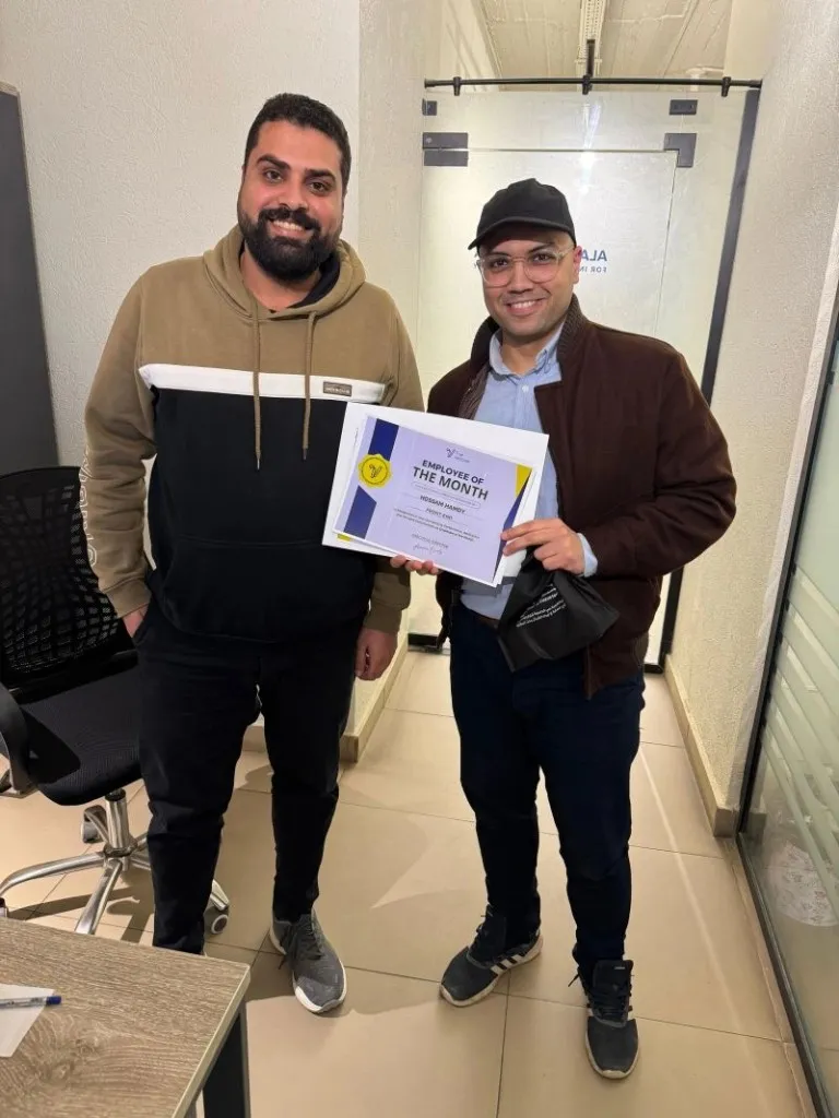 Hossam Hamdy receiving Employee of the Month at Al Almiya Alhura